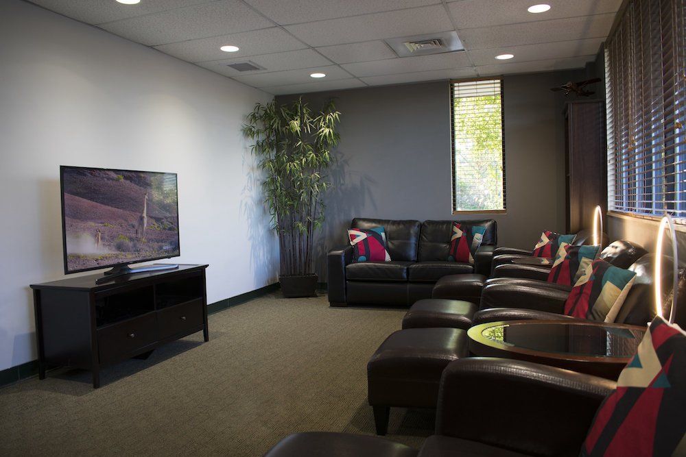 Pilot's lounge with comfortable seating and a television